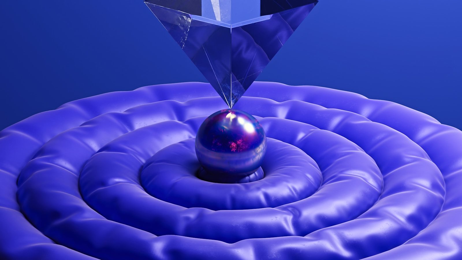 A blue abstract design with a pyramid.